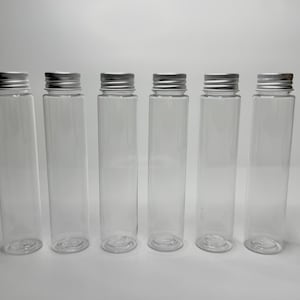 Clear plastic tubes with silver screw lid