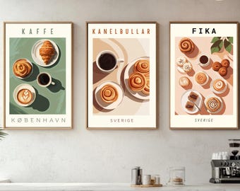 May include: Three framed art prints featuring coffee and pastries. The first print says "KAFFE" and "KØBENHAVN" with a croissant, coffee, and pastries. The second print says "KANELBULLAR" and "SVERIGE" with coffee and cinnamon rolls. The third print says "FIKA" and "SVERIGE" with coffee and pastries.