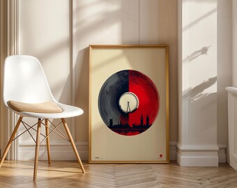 May include: A framed art print featuring a vinyl record design split into black and red halves. The red side showcases a London skyline silhouette, including the London Eye. The artwork is displayed near a white chair.