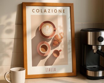 May include: A framed print with the word "COLAZIONE" at the top and "ITALIA" at the bottom. The print features a coffee cup with latte art, a croissant, and two other cups. A white mug sits in front of the frame.
