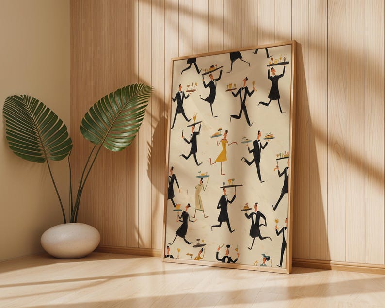 May include: A framed print featuring a repeating pattern of stylized waiters in black suits and dresses carrying trays. The artwork has a vintage aesthetic with a cream-colored background and a wooden frame. A decorative plant in a white pot is in the corner.