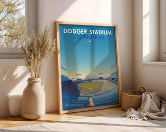 May include: A framed art print of Dodger Stadium in Los Angeles. The print features a stylized illustration of the baseball stadium with a blue sky background. The text "DODGER STADIUM LOS ANGELES" is at the top.