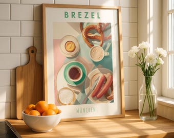 May include: A framed art print featuring a stylized illustration of a breakfast scene with pretzels, coffee, and sausages. The print has the word "BREZEL" at the top and "MUNCHEN" at the bottom. A bowl of oranges and a vase of white flowers are in the foreground.