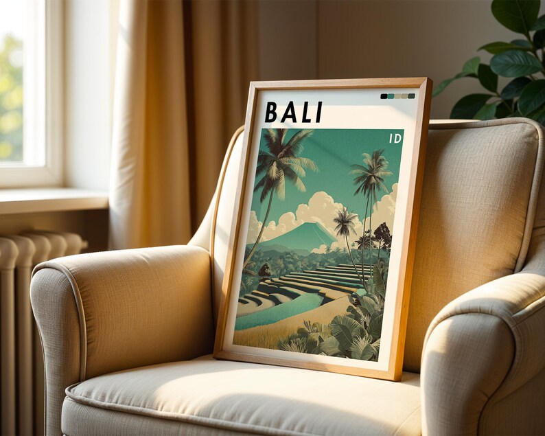 May include: A framed art print featuring a Bali landscape with palm trees, terraced rice fields, and a mountain. The word "BALI" is at the top, with "ID" below. The artwork has a vintage travel poster style, with a color palette of teal, beige, and green.