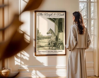May include: A framed print with the text "The Neigh & Nook" and a sepia-toned illustration of a horse resting in a stable. The print also includes the text "Quiet Mornings. Open Fields. Gentle Company."
