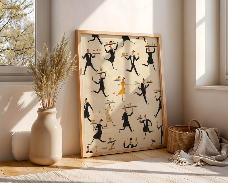 May include: A framed art print featuring a repeating pattern of stylized figures in black suits and dresses, carrying trays. The artwork has a light beige background and is set in a light wood frame. The print is leaning against a wall near a window.
