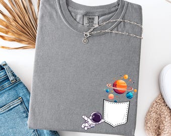 Comfort Colors Astronaut Pocket T-Shirt: Funny Galaxy Graphic Tee