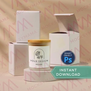 May include: A candle in a glass jar with a wooden lid, featuring a label with a floral design and the text "YOUR DESIGN HERE." The candle sits on a white pedestal, with white boxes in the background. The image also includes a "SMART OBJECT Ps" logo and a green banner that says "INSTANT DOWNLOAD."