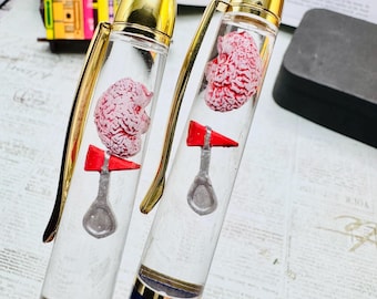 Pluma flotadora anatómica cerebral con martillo de reflejos - Regalo para médicos, neurólogos y enfermeros
