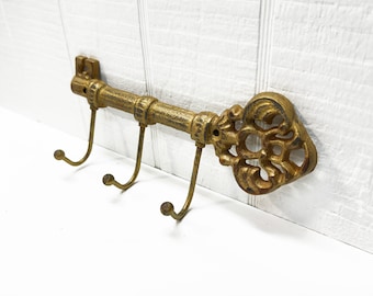 Ornate Cast Iron Key Shaped Key Holder With 3 Hooks in an Antique Gold Finish