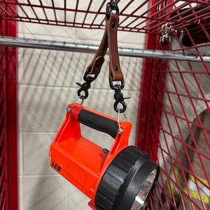 Firefighter flashlight strap
