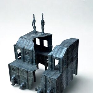 May include: A detailed, miniature model of a futuristic building, featuring a dark gray color scheme with intricate architectural details. The model has a weathered appearance, with pipes and industrial elements. The top right corner has the text "HB 4K".