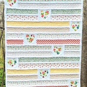 May include: A set of three ceramic mugs with a speckled, matte finish. The mugs are in shades of cream, light gray, and dark gray. Each mug has a simple, minimalist design, perfect for coffee or tea.