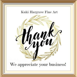 May include: A square sign in a gold frame featuring the text Kuki Hargrave Fine Art at the top and We appreciate your business! at the bottom. The center displays the words thank you in black script surrounded by a gold botanical wreath.
