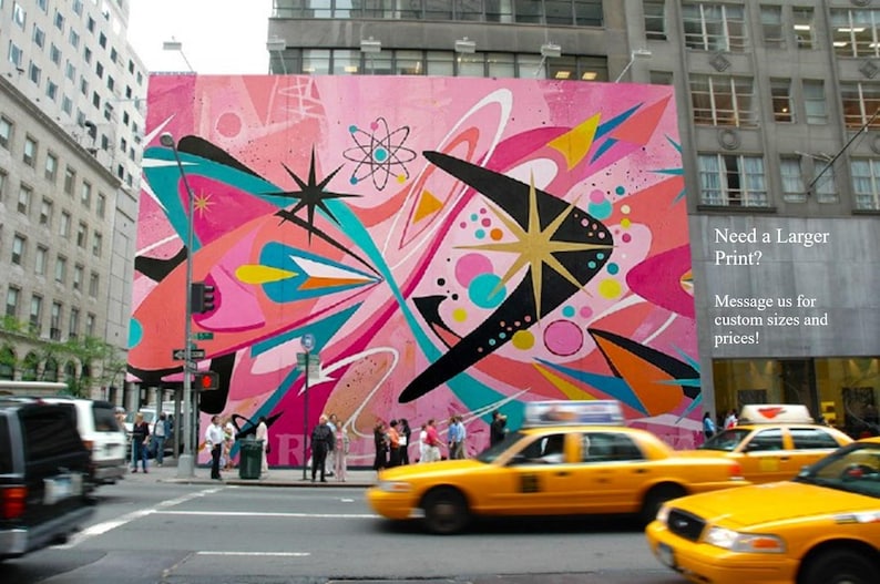 May include: A large, vibrant mural on a city building facade featuring abstract mid-century modern shapes, starbursts, and an atomic symbol in shades of pink, teal, black, and yellow. Text on the right reads: Need a Larger Print? Message us for custom sizes and prices!