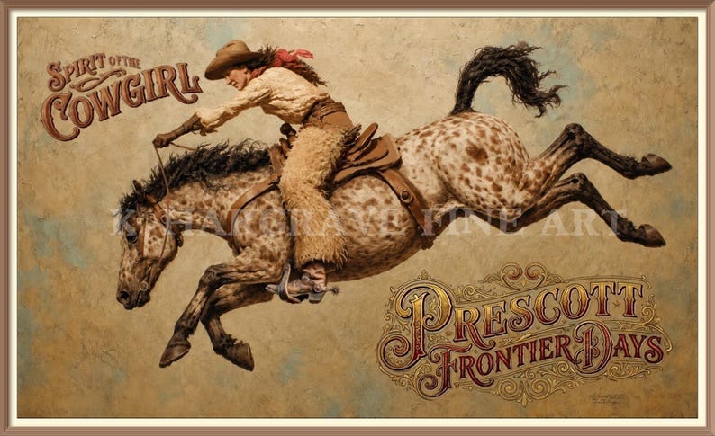 May include: A framed art print depicting a cowgirl in a tan hat, light shirt, and fringed chaps riding a bucking spotted horse. The text Spirit of the Cowgirl appears in the upper left, and Prescott Frontier Days is written in the lower right.