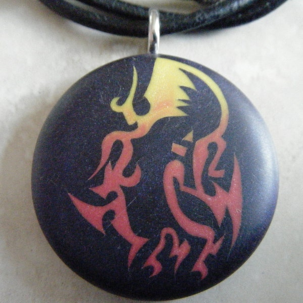 Kokopelli Fire Dance hand carved on a polymer clay midnight blue color background. Pendant comes with a FREE necklace