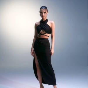 Black two-piece set: halter crop top with adjustable straps and high-slit skirt with hidden zipper—perfect for evenings and special events