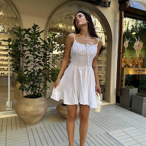 White muslin summer mini dress with open back and straps – casual lightweight cotton sundress, perfect for vacation or beach