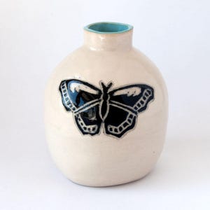 Hand built and hand painted vase with butterfly design