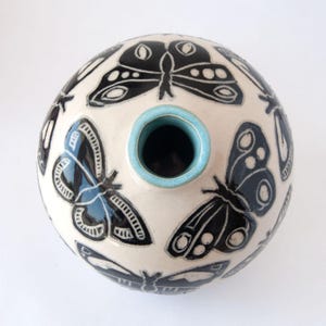 Hand made vase with butterfly design