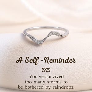 May include: A rustic wooden sign with the text "Welcome to our home" in white lettering. The sign features a distressed finish and a simple, inviting design, perfect for entryway decor.