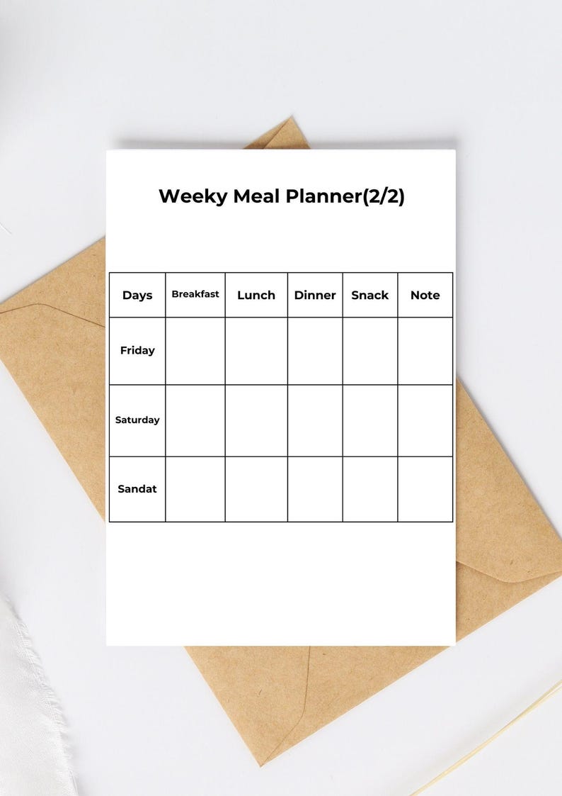 May include: A white weekly meal planner with a grid for each day of the week, including Friday, Saturday, and Sunday. The planner has sections for breakfast, lunch, dinner, snacks, and notes. The planner is on a brown envelope.