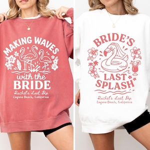 Puede incluir: Dos sudaderas, una coral y otra blanca, con gráficos a juego. La sudadera coral dice "Making Waves with the Bride" con diseños de flamencos y flores. La sudadera blanca dice "Bride's Last Splash" con un flotador de flamenco y un cóctel.