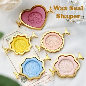 May include: An assortment of wax seal shapers in shades of pink, yellow, and blue, each with a gold-toned frame. The shapers display embossed designs. The image includes the text "Wax Seal Shaper".