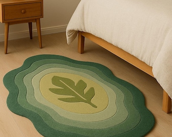 Tapete artesanal em formato de folha, tapete decorativo com detalhes botânicos e tufados, decoração orgânica inspirada na natureza.