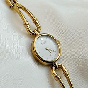 Vintage Seiko guldpläterade klockor med rubinfärgade accenter, unika armbandsdesigner; Present till henne 5. Seiko Oval dial