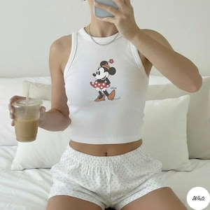 May include: A set of three ceramic mugs with a speckled, matte finish. The mugs are in shades of cream, light gray, and dark gray. Each mug has a simple, minimalist design, perfect for coffee or tea.