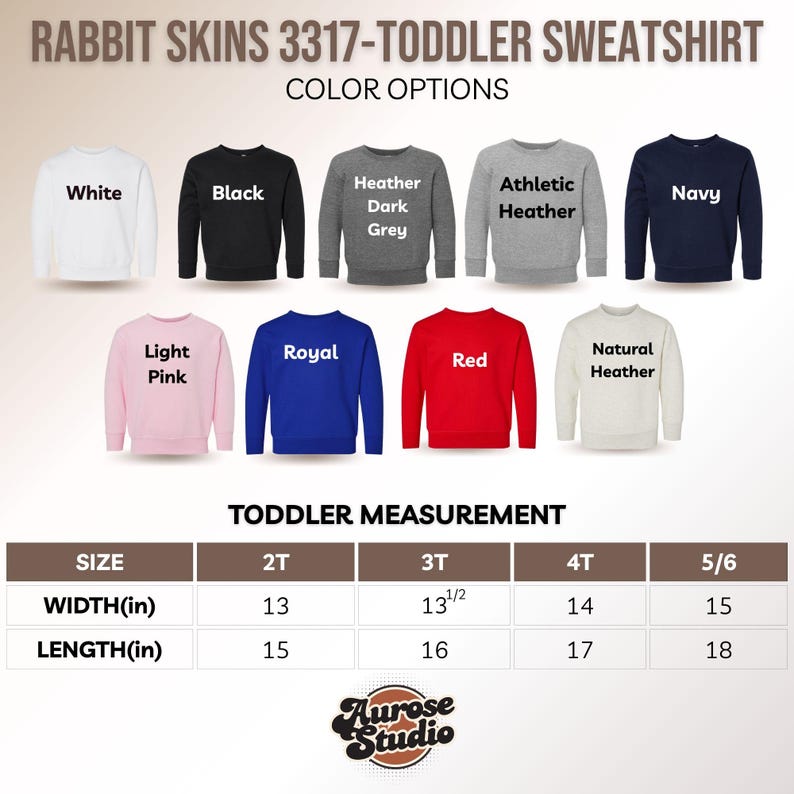 Puede incluir: Una exhibici&oacute;n de sudaderas para ni&ntilde;os peque&ntilde;os en varios colores, incluyendo blanco, negro y rosa. La imagen muestra opciones de color y medidas en cm para las tallas 2T a 5/6. El texto "RABBIT SKINS 3317-TODDLER SWEATSHIRT" est&aacute; en la parte superior.