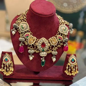 May include: A handmade wooden sign with the text "Welcome to our home" in a handwritten style. The sign is painted white with black lettering and a distressed finish, suitable for indoor or outdoor use.