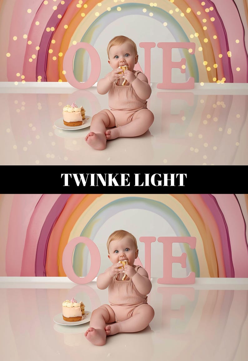 May include: A baby in a pink romper sits in front of a rainbow backdrop, eating a piece of cake. The word "ONE" is spelled out in large pink letters. A small cake sits on a white plate. Twinkle lights are in the background.