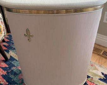 Vintage Pearl-Wick laundry hamper in a soft pink and white colorway