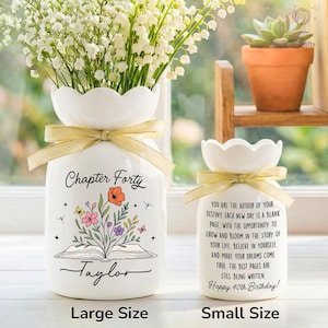 May include: Two white ceramic vases with scalloped tops and gold ribbon bows. The larger vase has the text "Chapter Forty" and "Taylor" with a floral and book design. The smaller vase says "Happy 40th Birthday!" with inspirational text.