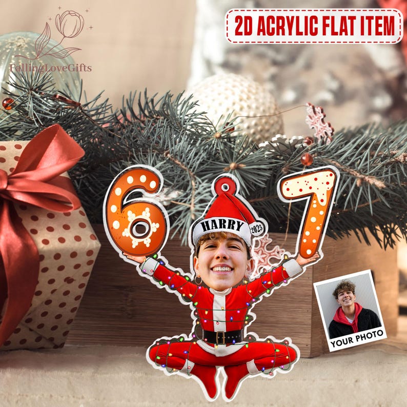 May include: A 2D acrylic flat item featuring a Santa Claus figure holding the numbers 6 and 7. The Santa figure has a personalized face and the text "HARRY 2023" on the hat. A photo is included with the text "YOUR PHOTO".