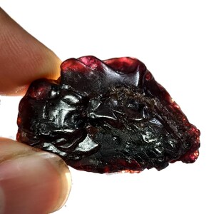 May include: A white ceramic mug with a black handle and the text "But First, Coffee" in a bold, black font. The mug is set against a blurred background, suggesting a cozy setting. The mug appears to be approximately 4 inches tall.