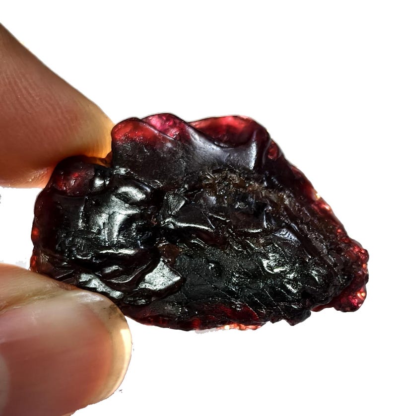 May include: A white ceramic mug with a black handle and the text "But First, Coffee" in a bold, black font. The mug is set against a blurred background, suggesting a cozy setting. The mug appears to be approximately 4 inches tall.