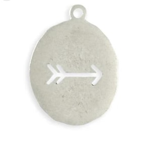 May include: Silver-toned metal pendant with an oval shape and a small loop at the top. The pendant features a cut-out arrow design in the center, pointing to the right. The surface has a textured appearance.