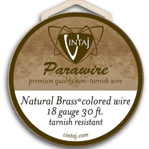 May include: A round, natural brass-colored wire spool with the text "Parawire" and "Natural Brass colored wire 18 gauge 30 ft. tarnish resistant". The spool has a white tag for hanging.