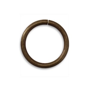 May include: A single, round, brass jump ring. The ring is open and ready to be used for jewelry making or other crafts.