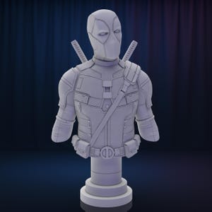 May include: A white painted bust of Deadpool, a superhero character, wearing a detailed costume with a mask. The bust is on a white pedestal.