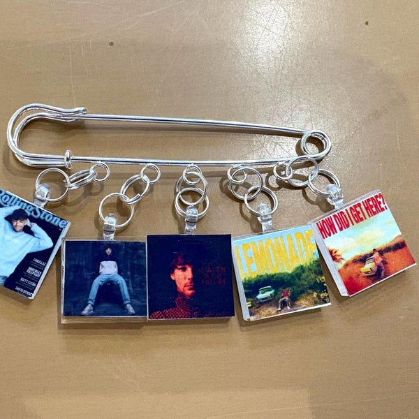 Louis Tomlinson Album Tribute Purse Pin – 5 Charm Silvertone Collector Brooch
