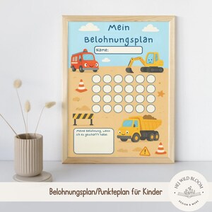 May include: A framed reward chart for children with a construction theme. The chart features a blue sky background with a fire truck, excavator, and dump truck. It includes spaces for rewards and the text "Mein Belohnungsplan".