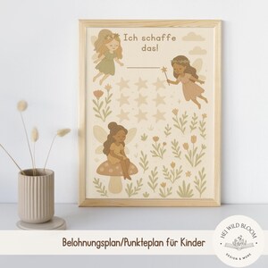 May include: A framed print with a fairy-themed design, including fairies, stars, and flowers. The German text "Ich schaffe das!" is at the top. The print is in a wooden frame, with a soft, neutral colour scheme.