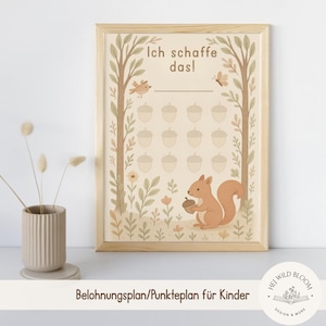 May include: A framed print with a woodland theme. The artwork features a squirrel holding an acorn, a bird, and a butterfly. The text "Ich schaffe das!" is at the top. The bottom text reads "Belohnungsplan/Punkteplan für Kinder".