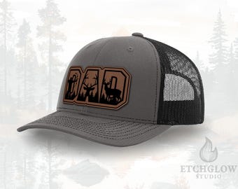 DAD Bow Hunting Hat – Deer Scene Inside Letters Patch – Leatherette Trucker Hat