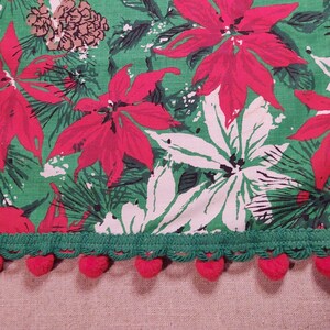 TWO 28 Inch Square Christmas Holiday Red with White Poinsettia Green Pine Tassels and Cones Red Pom Pom Fringe Tablecloths